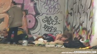 A Threesome Of Homeless People Engage In Sexual Activity In A Public Place, Captured On Amateur Video