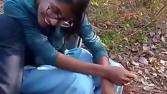 A Mature Indian Teacher Engages In Sexual Activity With Her Students In A Forest For Financial Gain